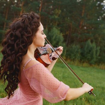 Beautiful Violinist Girl In Pink Dress Walking In       Utc