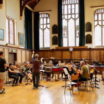 Baroque Orchestra rehearsing with Andrew Griffiths in Big School Hall